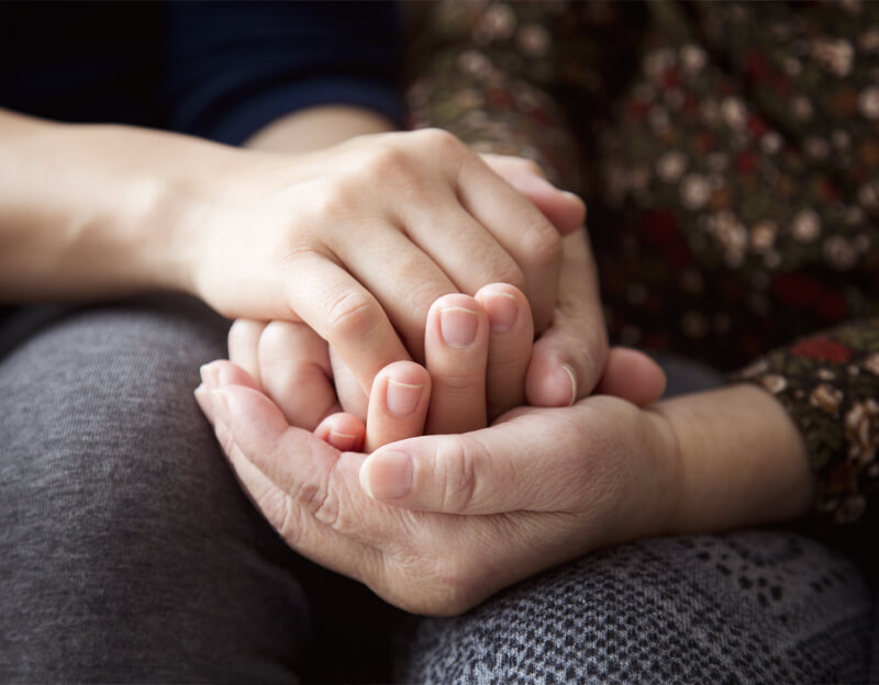 Hands holding each other