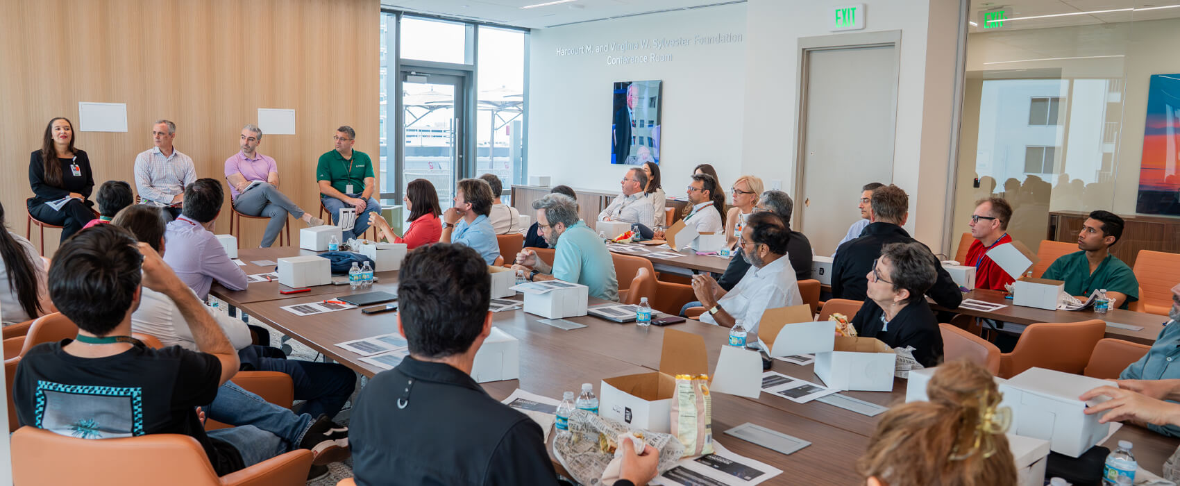 Attendees of the Sylvester Innovates Lunch and learn sitting and listening to speakers