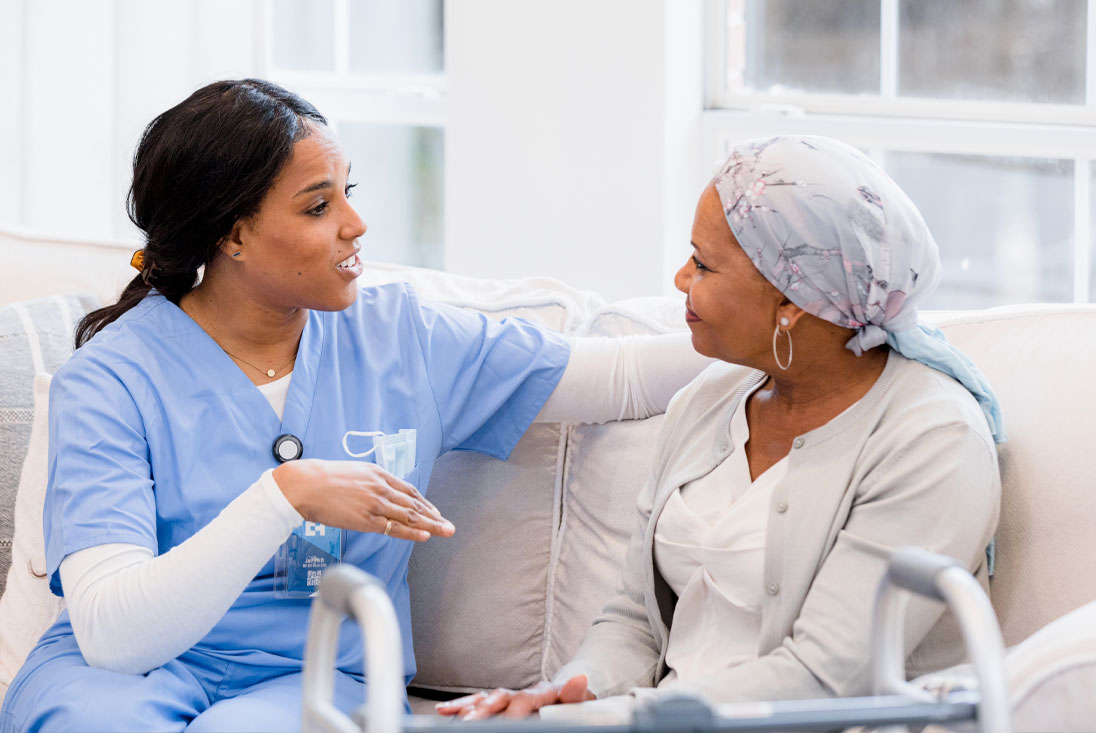 A nurse speaking with a patient