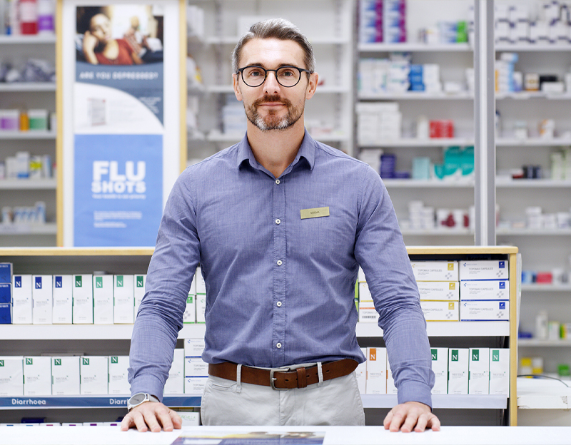 Man standing in a pharmacy