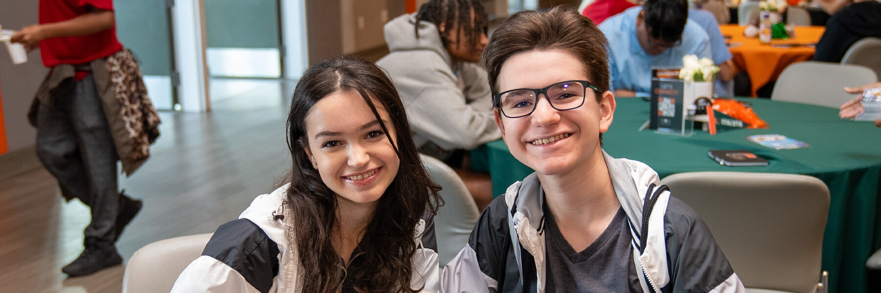 Young boy and girl sitting next to each other