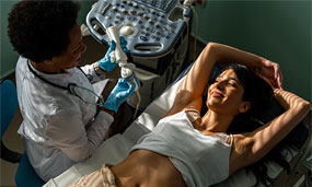 Woman laying on a bed about to have a diagnostic procedure