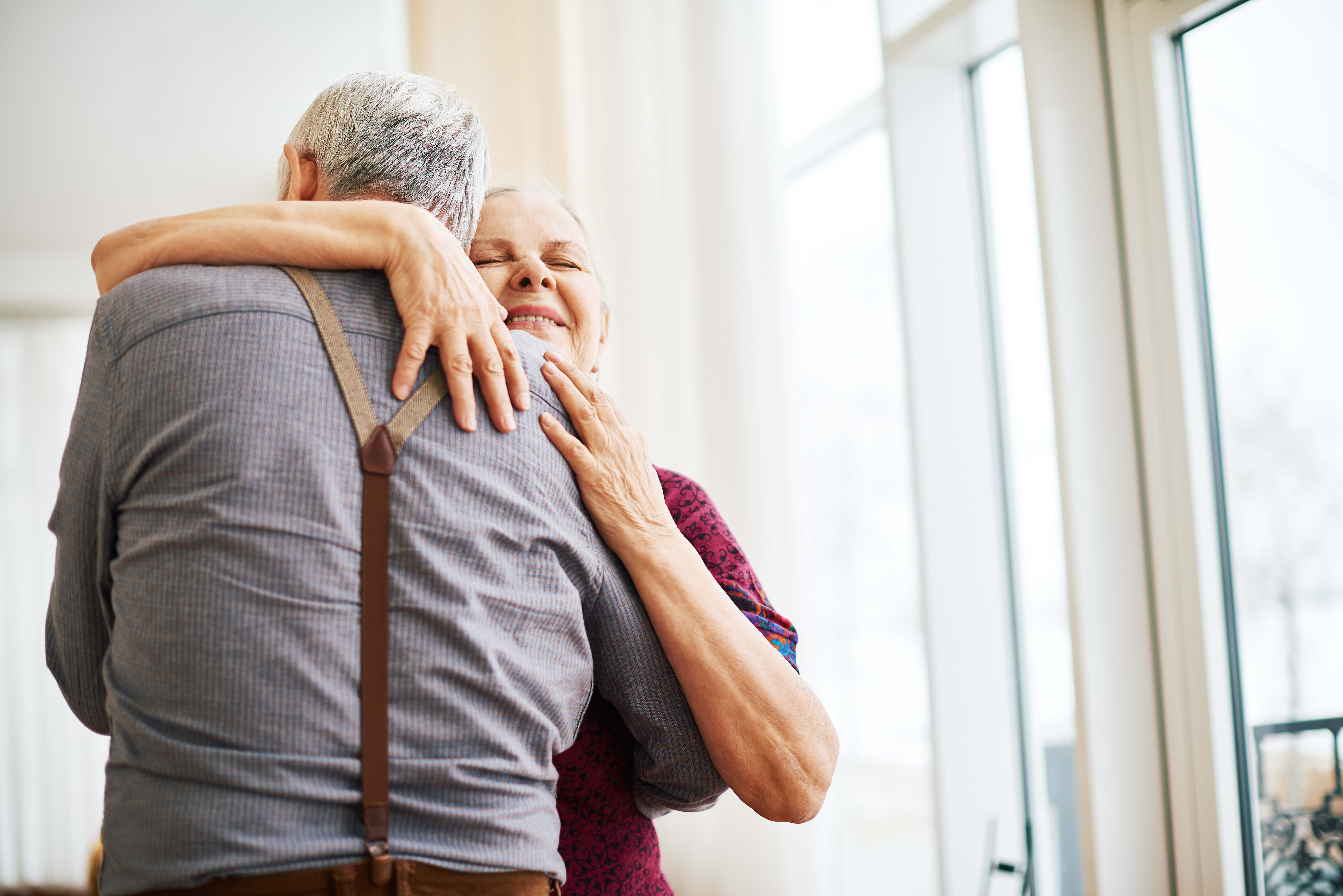 Older couple hugging