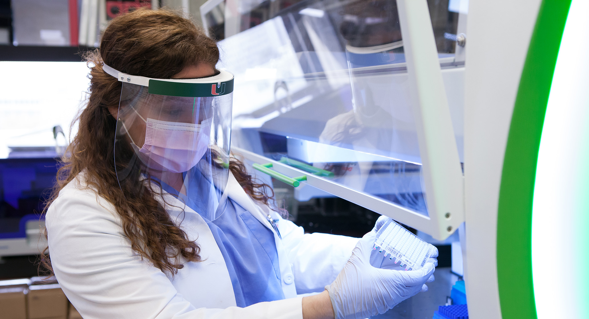 Researcher working with COVID-19 samples