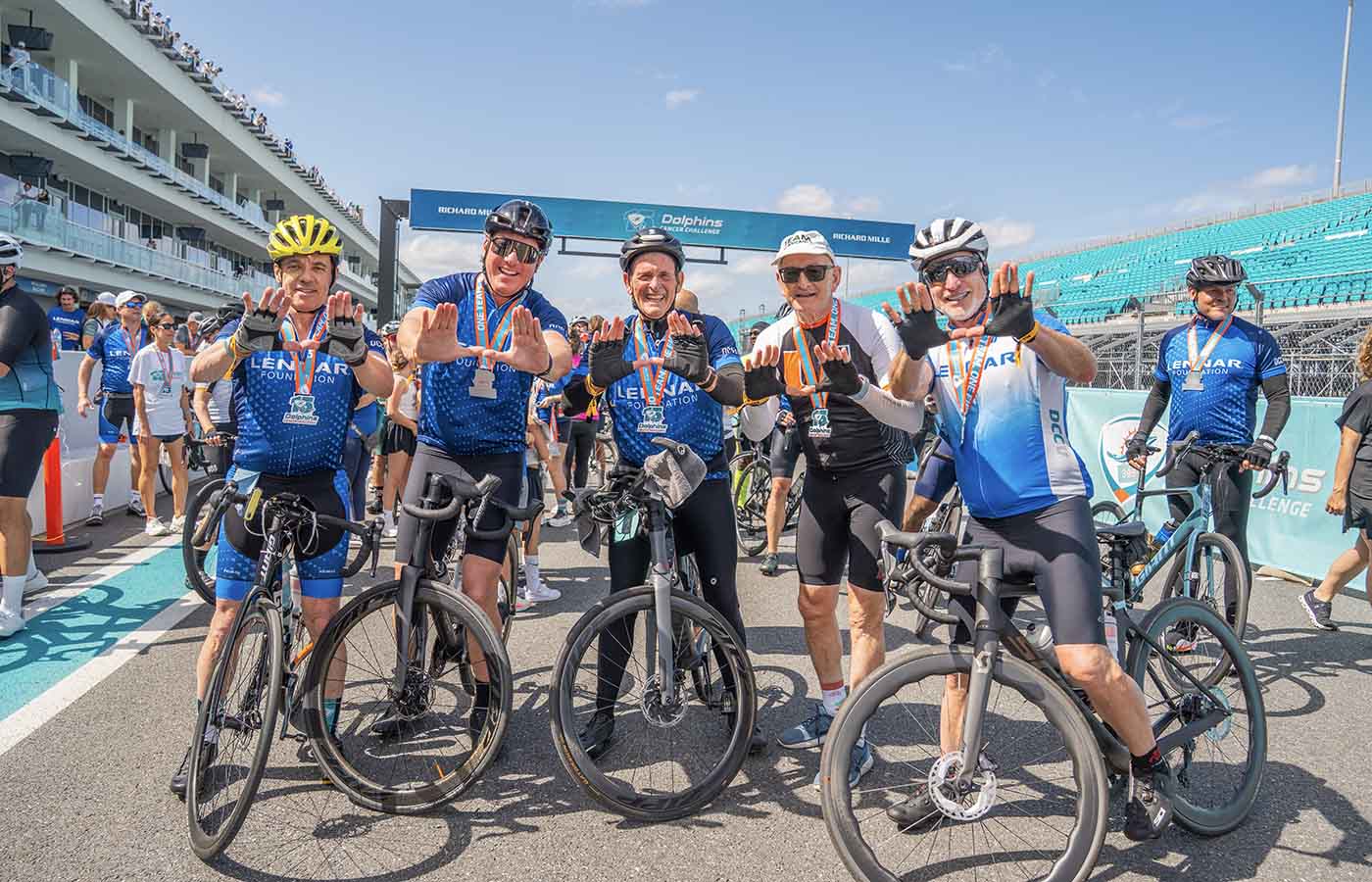 Sylvester Director poses with other riders at DCC