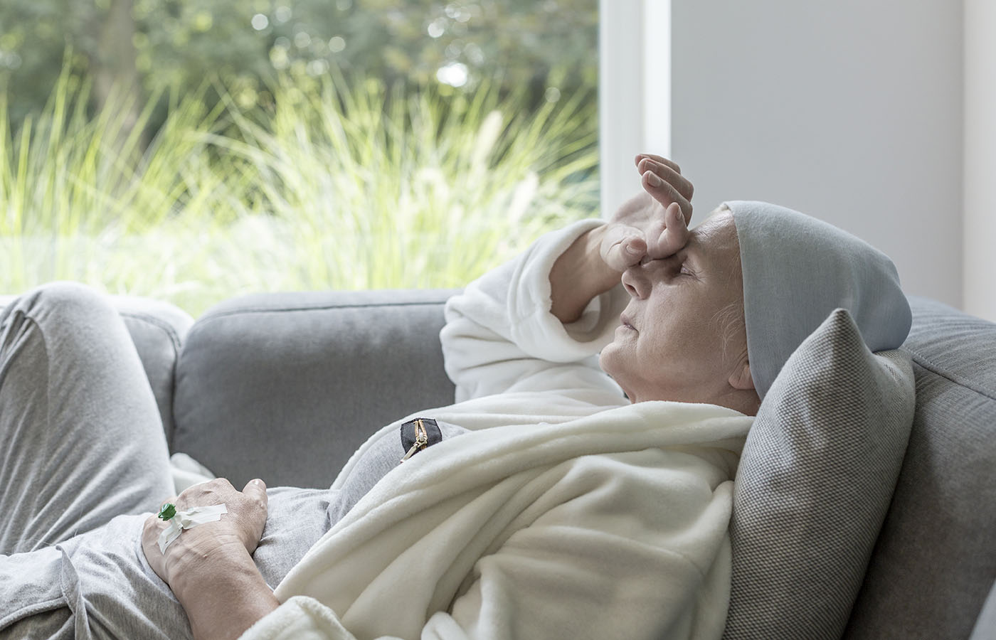 Woman with pain lying in bed