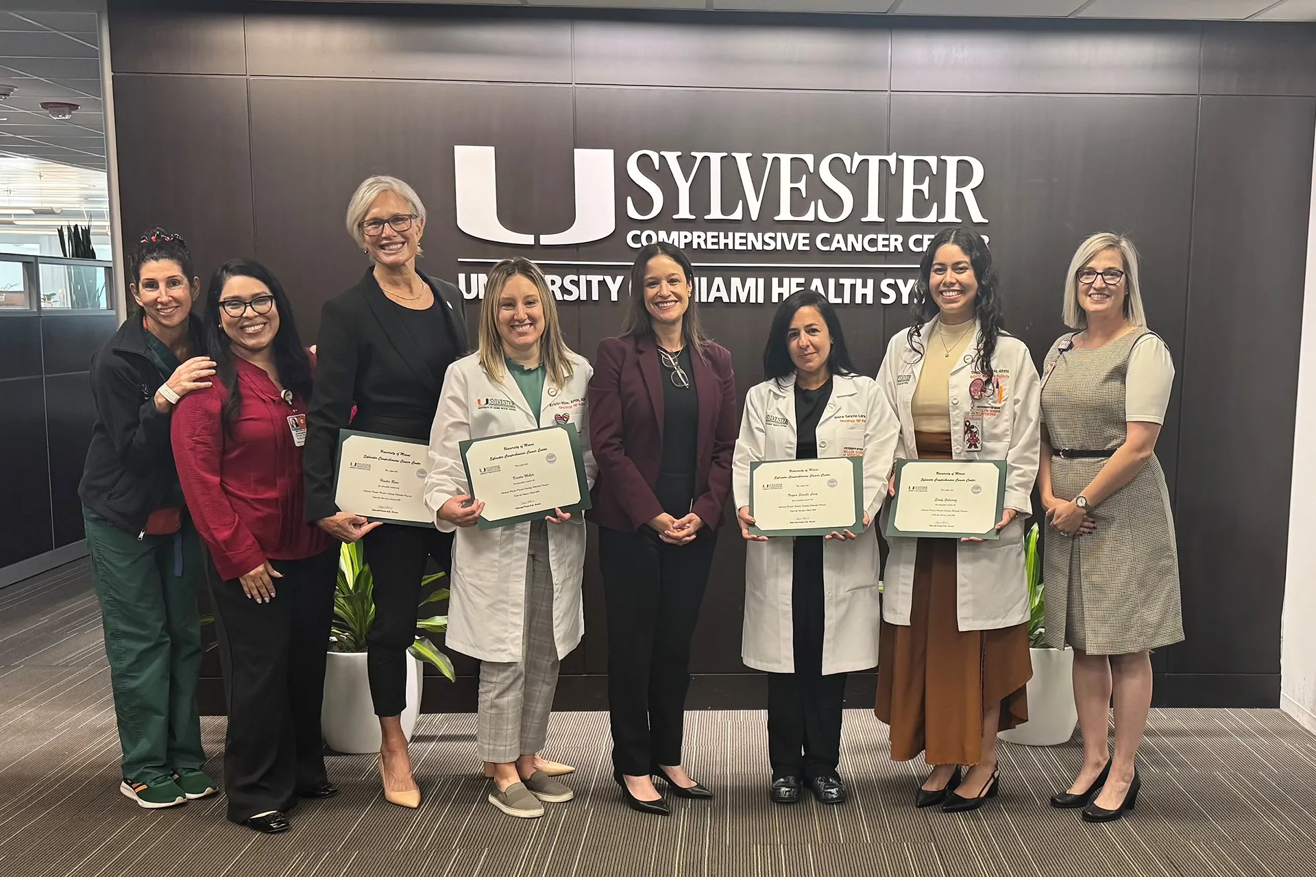 Nursing fellowship graduates take a group photo at an event