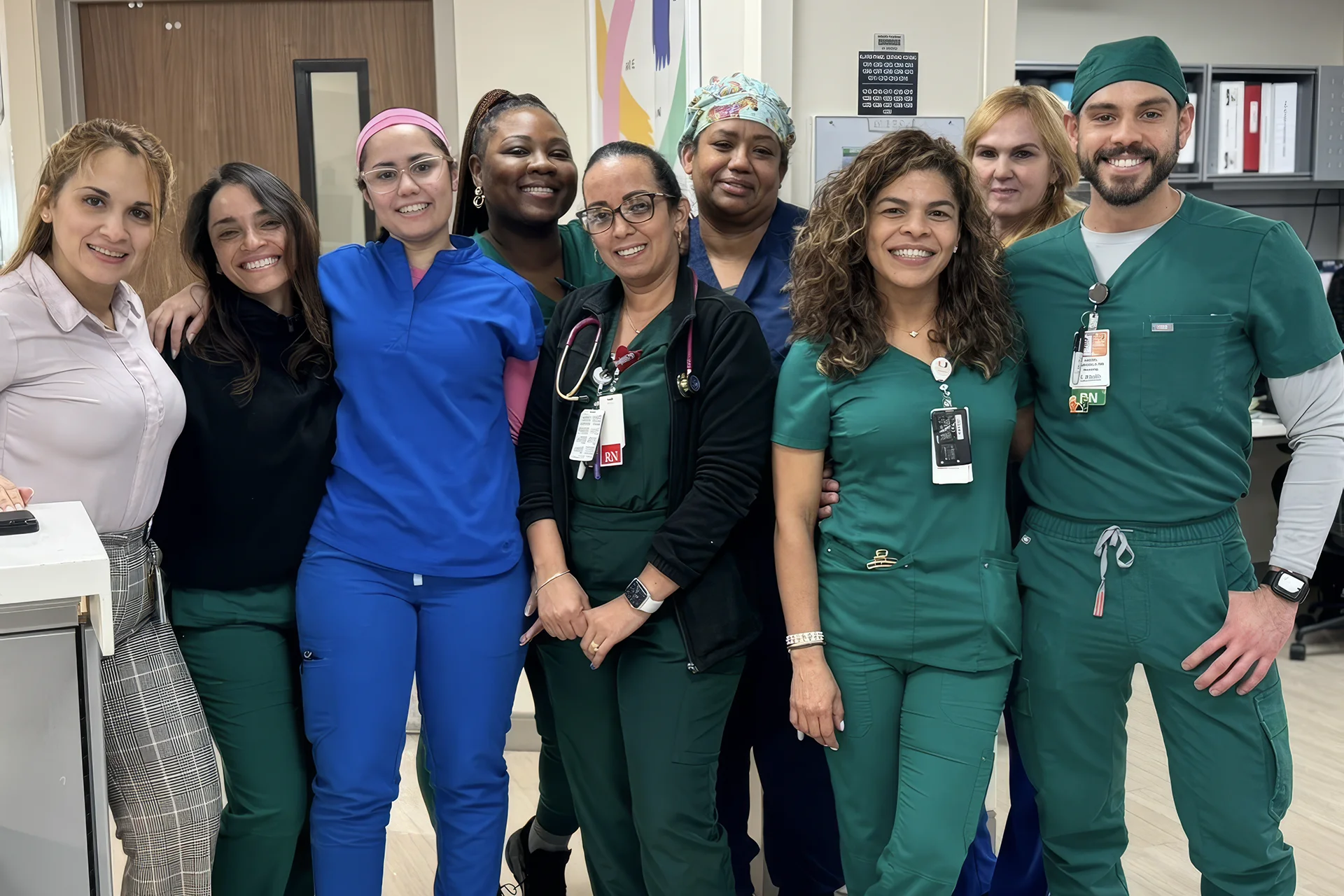 Group of nurses in scrubs pose for a group photo at UHealth in Miami