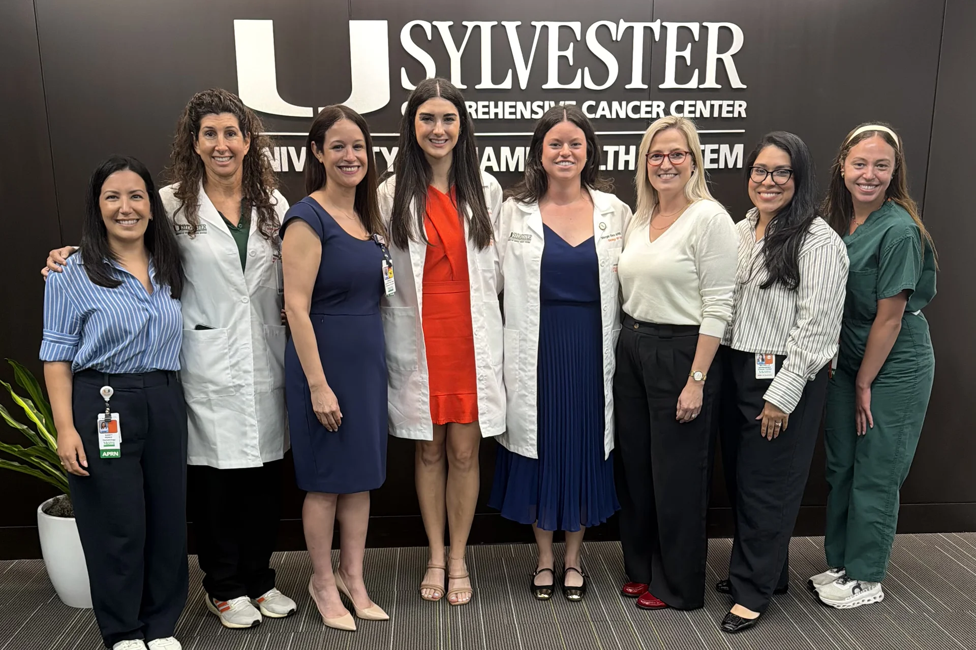 Nursing fellowship graduates take a group photo at an event
