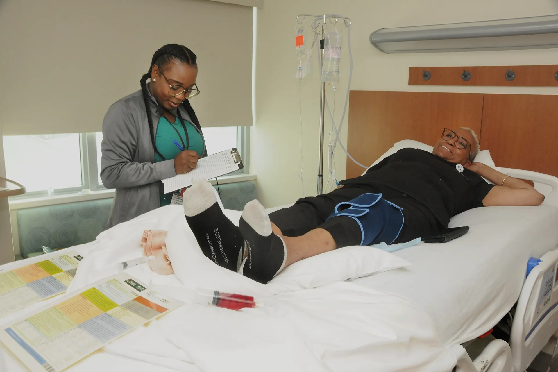 Nurse working with a patient to practice patient safety